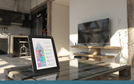 Tablet displaying smart home technology sitting on coffee table in Switzer apartment